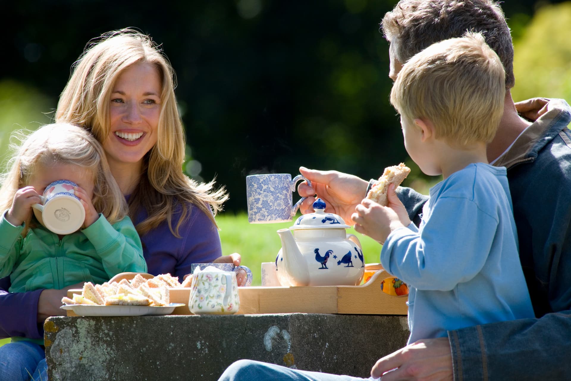 Family sharing tea together
