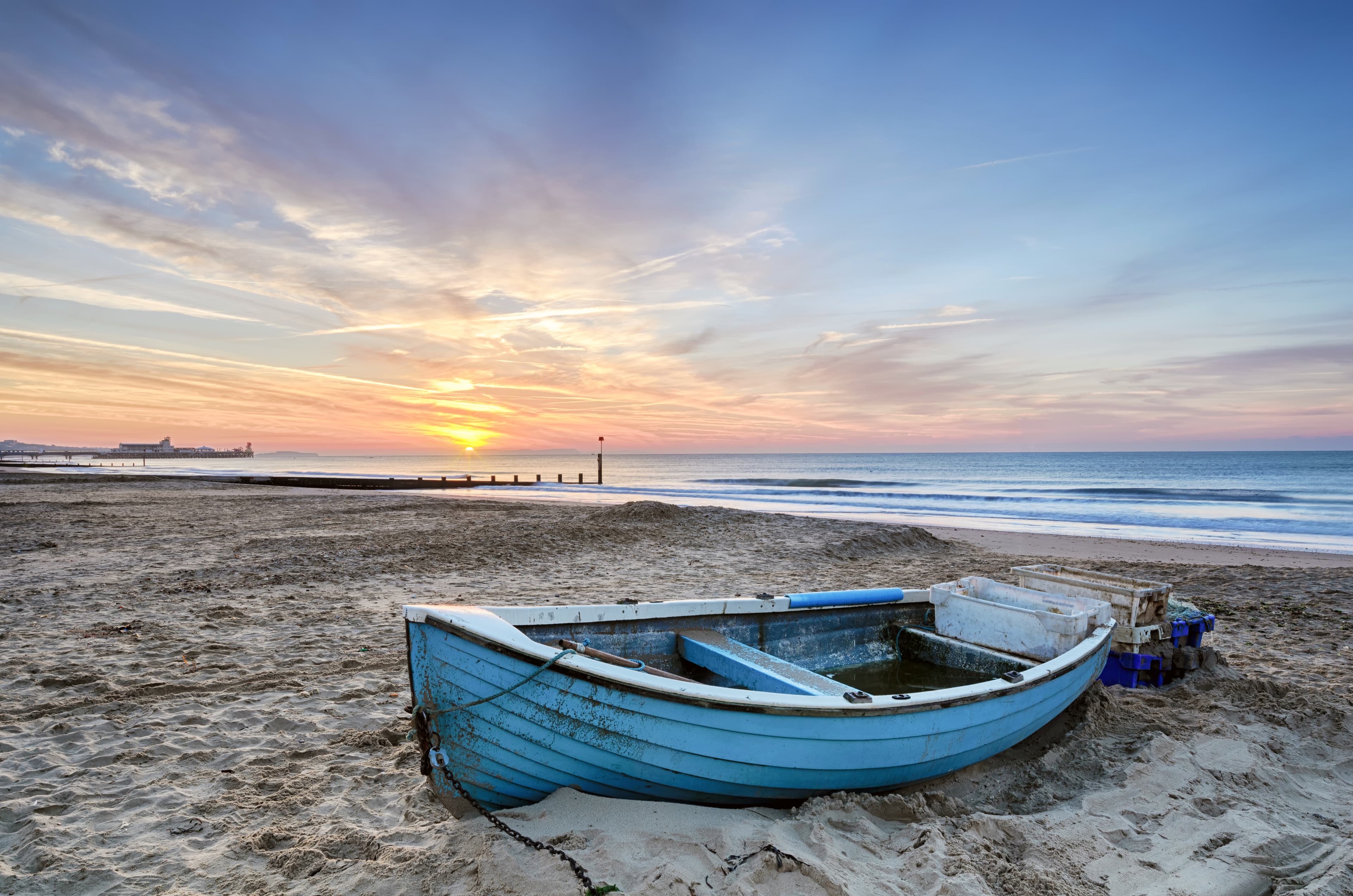 Blue fishing boat on the beach at Poole, Dorset